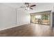 Living room with tile floor, sliding glass doors, and ceiling fan at 7625 E Camelback Rd # A418, Scottsdale, AZ 85251