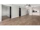 Open living area with wood-look tile floors at 7625 E Camelback Rd # A418, Scottsdale, AZ 85251