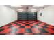 Garage with red and black checkered floor at 8631 E Mariposa Dr, Scottsdale, AZ 85251