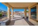 Covered patio overlooking a sparkling pool at 11040 E Tumbleweed Ave, Mesa, AZ 85212