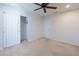 Bedroom with ceiling fan and sliding closet doors at 11040 E Tumbleweed Ave, Mesa, AZ 85212