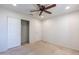 Bedroom with ceiling fan, closet, and neutral decor at 11040 E Tumbleweed Ave, Mesa, AZ 85212