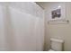 Bathroom with shower/tub combo and white shower curtain at 11040 E Tumbleweed Ave, Mesa, AZ 85212