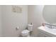 Clean bathroom with toilet, sink, and vanity with a large mirror at 11040 E Tumbleweed Ave, Mesa, AZ 85212