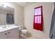 Bathroom with toilet, sink, and shower/tub at 11040 E Tumbleweed Ave, Mesa, AZ 85212
