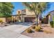 Two-story house with a two-car garage and landscaping at 11040 E Tumbleweed Ave, Mesa, AZ 85212