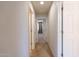 Clean hallway with doors to bedrooms and bath at 11040 E Tumbleweed Ave, Mesa, AZ 85212