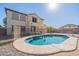 Inviting kidney-shaped pool with safety fence in backyard at 11040 E Tumbleweed Ave, Mesa, AZ 85212