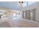 Open living room with high ceilings and neutral color palette at 11040 E Tumbleweed Ave, Mesa, AZ 85212