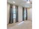 Well-lit bedroom with two windows and ceiling fan at 11040 E Tumbleweed Ave, Mesa, AZ 85212