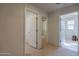 Hallway with carpet flooring and access to bedrooms at 11040 E Tumbleweed Ave, Mesa, AZ 85212