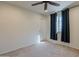 Bright bedroom with ceiling fan and window coverings at 11040 E Tumbleweed Ave, Mesa, AZ 85212