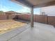 Private backyard with covered patio and grassy area at 18212 W Illini St, Goodyear, AZ 85338