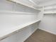 Large walk-in closet with ample shelving and hanging rods at 18212 W Illini St, Goodyear, AZ 85338