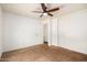 Spacious bedroom featuring a ceiling fan and ample closet space at 8254 E Posada Ave, Mesa, AZ 85212