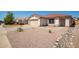 Charming one-story house with a two-car garage and rock landscaping at 8254 E Posada Ave, Mesa, AZ 85212