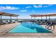 Rooftop pool with city views and comfortable lounge chairs at 7175 E Camelback Rd # 107, Scottsdale, AZ 85251