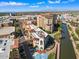 Aerial view of luxury condos by the waterway and city at 7175 E Camelback Rd # 107, Scottsdale, AZ 85251