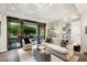 Living area with access to a private patio, featuring a comfy sofa at 7175 E Camelback Rd # 107, Scottsdale, AZ 85251
