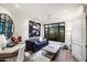 Home office with a comfortable sofa, large window, and a work desk at 7175 E Camelback Rd # 107, Scottsdale, AZ 85251