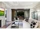 Living room with fireplace, patio access, and modern decor at 7175 E Camelback Rd # 107, Scottsdale, AZ 85251