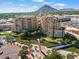 Aerial view of luxury condos near waterway and Camelback Mountain at 7175 E Camelback Rd # 107, Scottsdale, AZ 85251