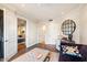 Bright home office features built-in desk and hardwood floors at 7175 E Camelback Rd # 107, Scottsdale, AZ 85251