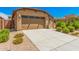 A house with a two-car garage and nicely landscaped front yard at 5837 N 89Th Dr, Glendale, AZ 85305