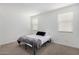 Simple bedroom with carpeted floor and a double bed at 5837 N 89Th Dr, Glendale, AZ 85305