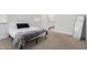 Spacious bedroom with a full-size bed and large mirror at 5837 N 89Th Dr, Glendale, AZ 85305