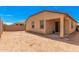 Home's backyard with covered patio and sand at 5837 N 89Th Dr, Glendale, AZ 85305