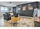 Living room with dark walls, comfy seating, and movie theme at 5837 N 89Th Dr, Glendale, AZ 85305