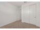 Bedroom with double doors and closet at 5837 N 89Th Dr, Glendale, AZ 85305