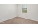 Small bedroom with carpeted floor and window at 5837 N 89Th Dr, Glendale, AZ 85305