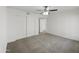 Spacious bedroom with double door closet and ceiling fan at 2711 N Olympic Cir, Mesa, AZ 85215