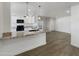 Open concept kitchen with granite countertops and island at 2711 N Olympic Cir, Mesa, AZ 85215