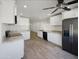 Modern kitchen with white cabinets and granite countertops at 2711 N Olympic Cir, Mesa, AZ 85215