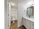 Clean bathroom with white vanity and toilet at 2711 N Olympic Cir, Mesa, AZ 85215