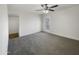Spacious bedroom with grey carpet and ceiling fan at 2711 N Olympic Cir, Mesa, AZ 85215