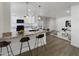 Open concept kitchen with granite countertops and island at 2711 N Olympic Cir, Mesa, AZ 85215