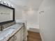 Updated bathroom with granite vanity and bathtub at 2711 N Olympic Cir, Mesa, AZ 85215