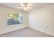 Spacious bedroom with a large window and ceiling fan at 14300 W Bell Rd # 35, Surprise, AZ 85374