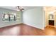 Spacious bedroom with large window, hardwood floors and ceiling fan at 14300 W Bell Rd # 35, Surprise, AZ 85374