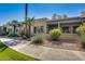 Well-maintained exterior of condo with walkway and landscaping at 14300 W Bell Rd # 35, Surprise, AZ 85374