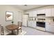 Cozy kitchen featuring white cabinets and a breakfast nook at 14300 W Bell Rd # 35, Surprise, AZ 85374