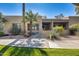 Condo exterior with lush landscaping and walkway at 14300 W Bell Rd # 35, Surprise, AZ 85374
