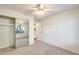 Bedroom with mirrored closet and access to other rooms at 14300 W Bell Rd # 35, Surprise, AZ 85374