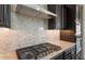 Close-up of gas cooktop and granite countertop in a modern kitchen at 13776 W Calle De Baca --, Peoria, AZ 85383