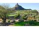 Stunning view of a golf course with desert landscape and mountain backdrop at 10040 E Happy Valley Rd # 1010, Scottsdale, AZ 85255