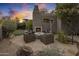 Evening view of patio with fireplace and seating area at 10040 E Happy Valley Rd # 1010, Scottsdale, AZ 85255